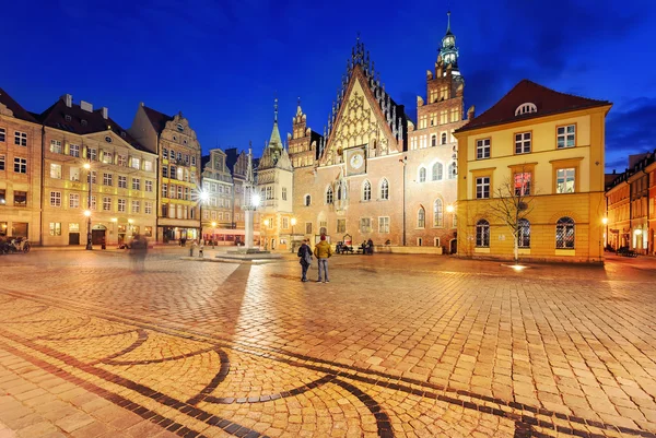 Tourists visiting market square in Wroclaw near the town hall.