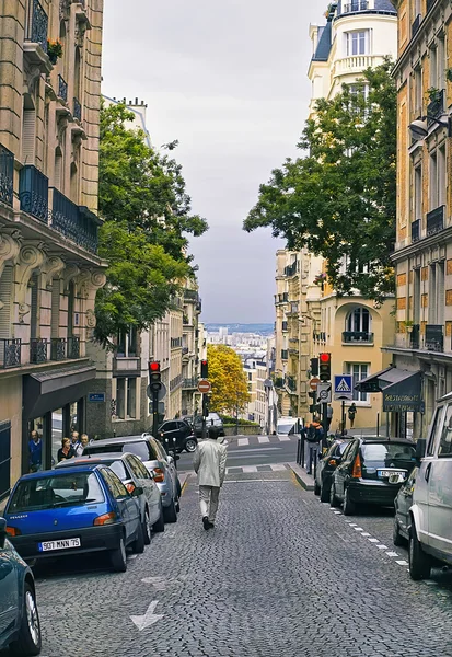 People walk on the Montmartre district in Paris, France.