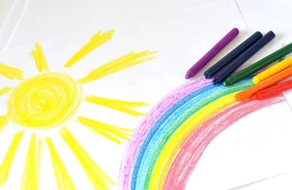 Picture of sun and rainbow made with wax crayons