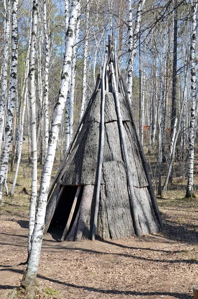 Irkutsk region,RU-May,10 2015: Pole chum - portable dwelling in a conical shape, covered with bark. Museum of Wooden Architecture