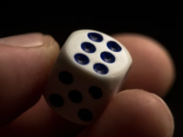 Dice in human hand