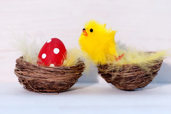 One Red Easter Egg And Yellow Chick In Nest