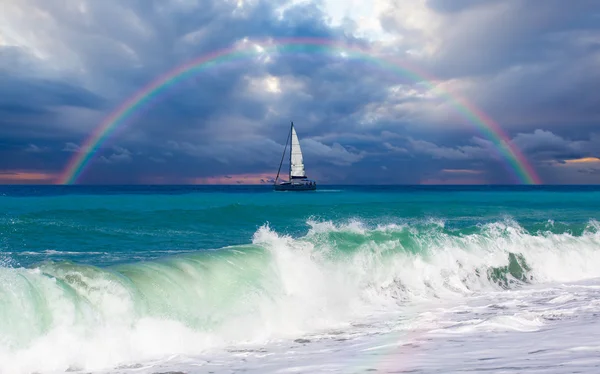 Lonely boat against rainbow