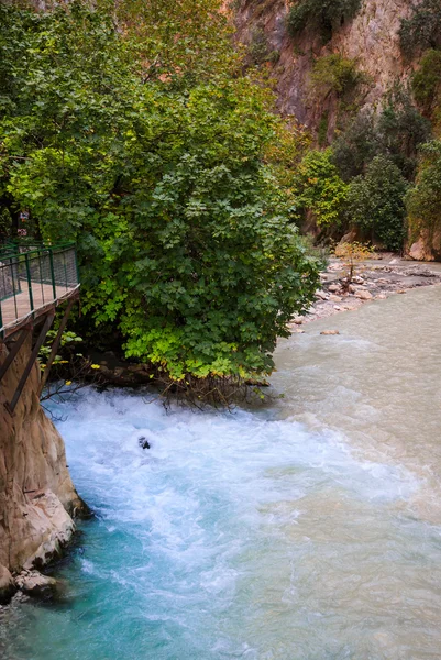 Mountain stream full of smooth rocks in Saklikent Gorge Canyon in Turkey