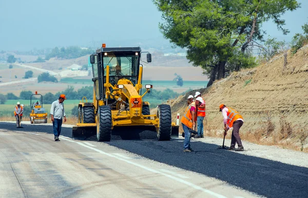 KAYSERI - AUGUST 15: workers repairs road under the program of planned on August 15 2014 in kayseri Turkey