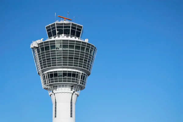 Munich air traffic control tower against clear blue sky