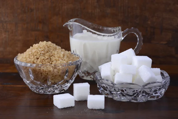 Cream and sugar in crystal glassware.