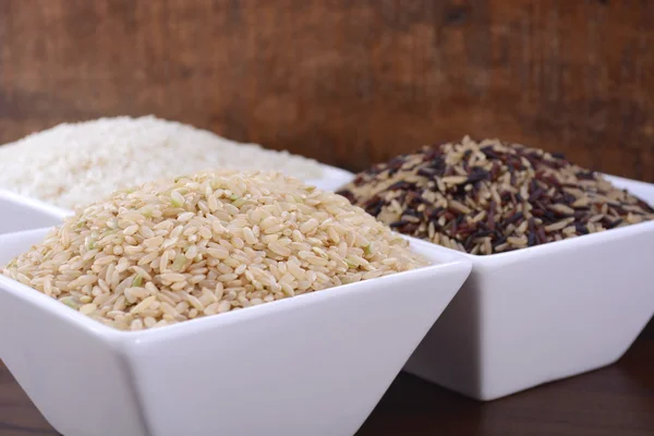 Square bowls of uncooked rice