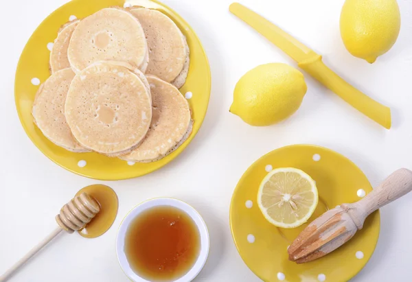 Pancakes, honey and lemons