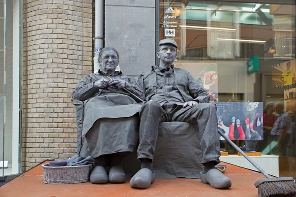 Arnhem, Netherlands - September 28, 2014: artists depict old couple during world championships living statues in Arnhem