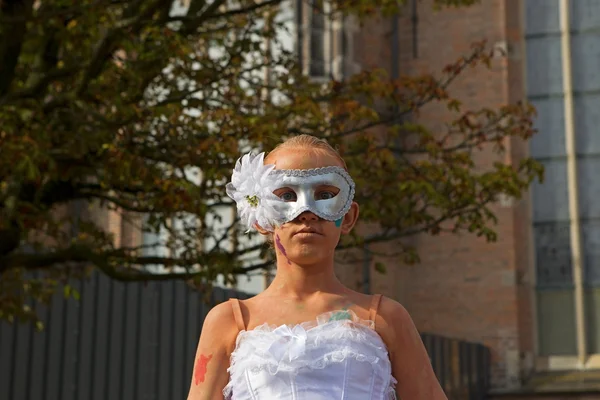 Arnhem, Netherlands - September 28, 2014: Masked artist on Eusebiusplein during world championships living statues in Arnhe