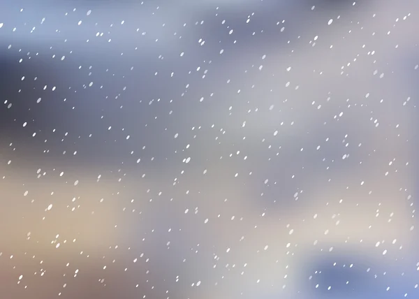 Falling snow on a blurred background.