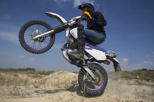 Motocross bike.A man rides on a mountain road on the motocross bike.