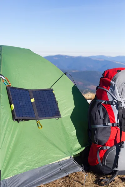 The solar panel attached to the tent.