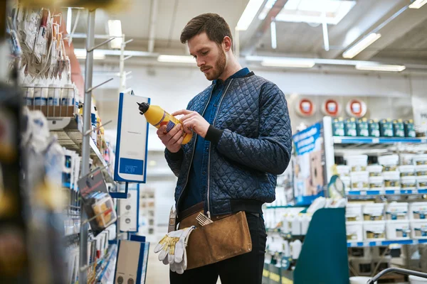 Handyman selecting his purchase