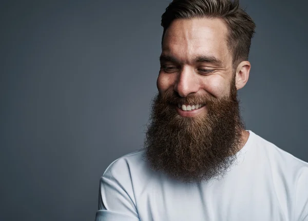 Happy young man with fuzzy beard