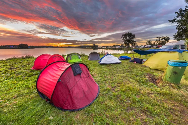 Camping spot with dome tents near lake