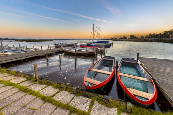 Rental rowing boats in a marina at dutch lake
