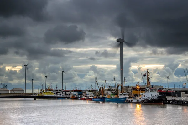Industrial harbor landscape with dark sky