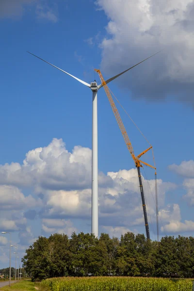 Wind turbine being serviced
