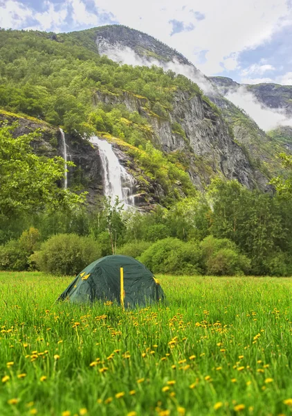 Spring at camping. tourist tent in the Norway mountains at sunrise