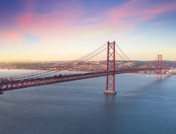 Red bridge at season sunset, Lisbon, Portugal.