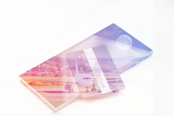 Double exposure: credit card on smartphone and aircraft. Business and travel concept. Vintage style filtered picture