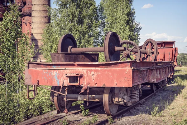 Old flat wagon with railcar wheelset