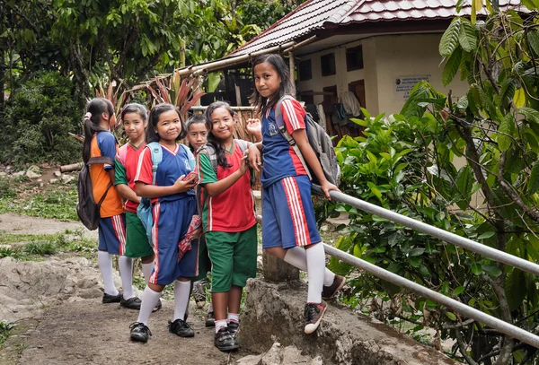 Group of teenagers in school sport uniform near Suaya site at Tana Toraja