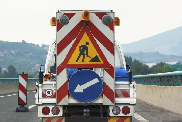 Helping safety truck on the road traffic sign highway