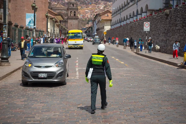 Traffic police woman in the streets of Cusco, Peru