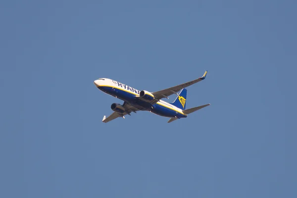 Flying Boeing 737-8 aircraft, Ryan Air Flight, clear blue sky