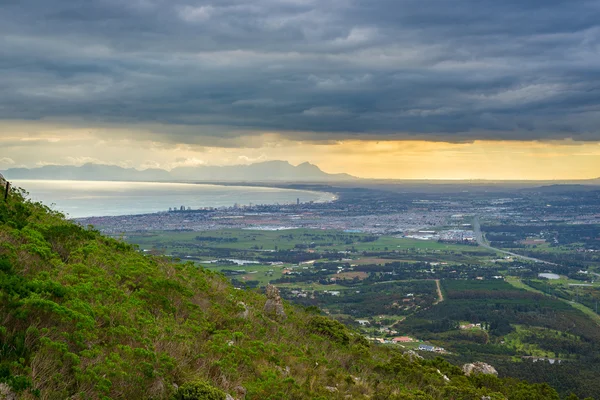 Aerial view of Cape Town from Sir Lowry\'s Pass, South Africa. Winter season, cloudy and dramatic sky.