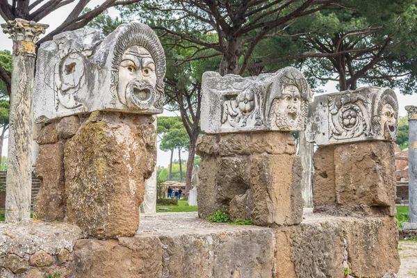 Roman masks in the old town of Ostia, Rome, Italy