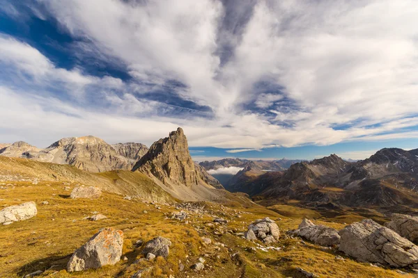 High altitude alpine landscape and scenic sky in autumn