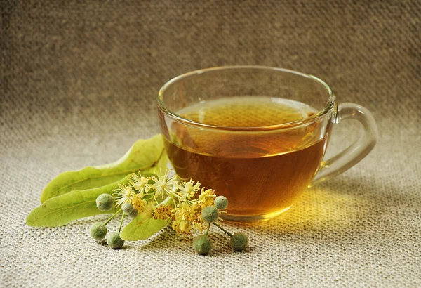 Glass cup of tea. Linden flowers. Herbal tea.