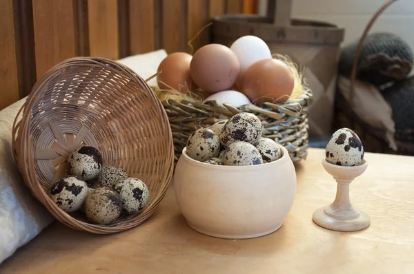 Chicken and quail eggs, healthy food with chicken farm on the table