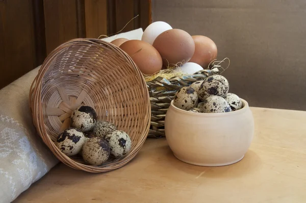 Chicken and quail eggs, healthy food with chicken farm on the table