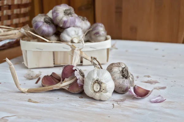Garlic on the table. Unwashed vegetables, farm product