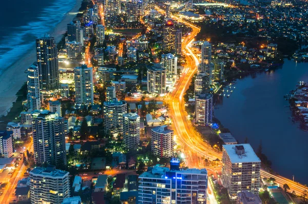 City skyscrapers and traffic at night, aerial, long exposure