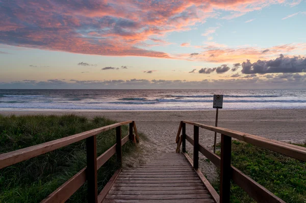 Beautiful ocean beach entrance at sunrise