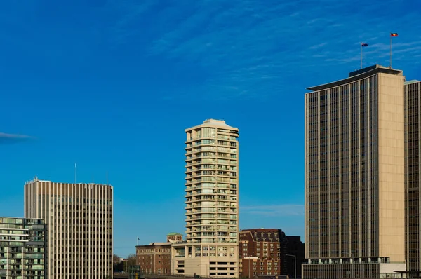 Skyscrapers against blue sky on the background