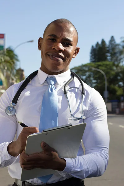 Young Black doctor with stethoscope around his neck