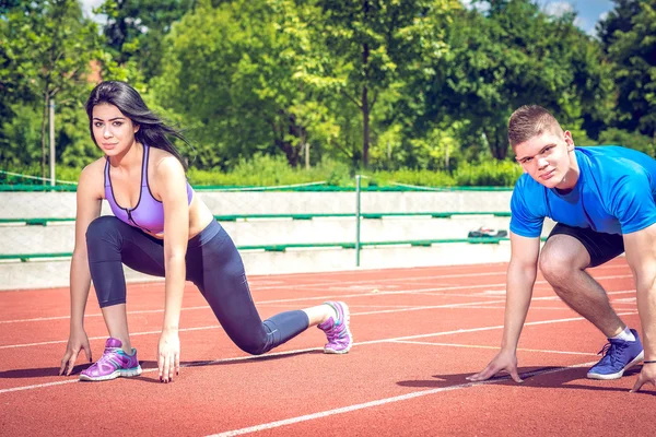 Running couple outdoors.