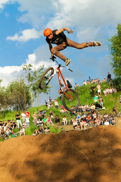 Moscow, Russia, June 06, Biker is making stunt at his mountain bike at Pit Jam contest, June 06, 2011 in Moscow, Russia