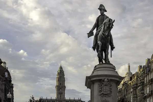 PORTO, PORTUGAL - JULY 04, 2015: Monument of King Pedro IV statue in foreground and city hall in the top of Aliados Avenue, on July 04, 2015 in Porto, Portugal.