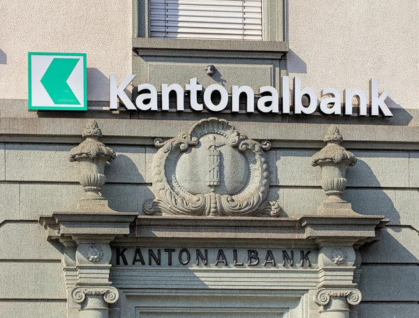 Sign and relief on the wall of an St. Gallen Cantonal bank office