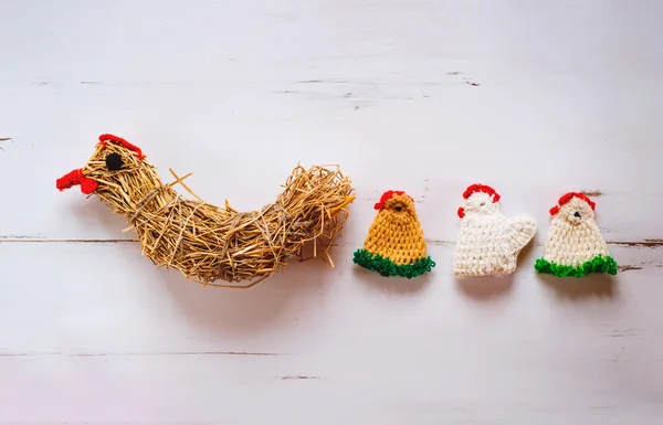 Crocheted Easter chickens and straw hen