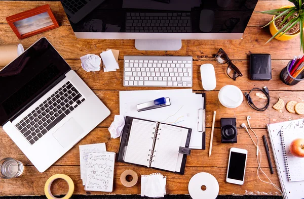 Desk with various gadgets and office supplies. Flat lay