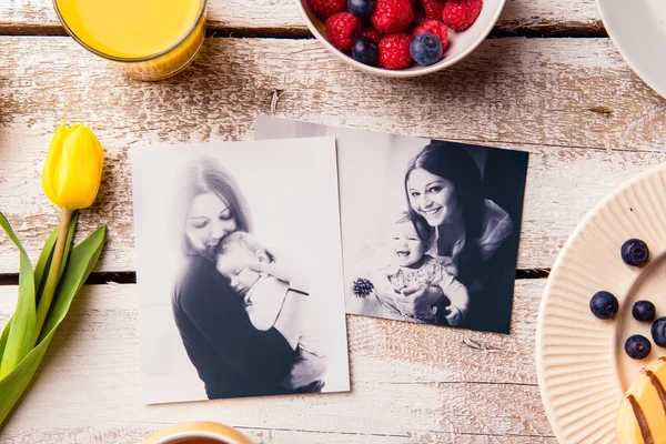 Mothers day composition. Black-and-white pictures and breakfast